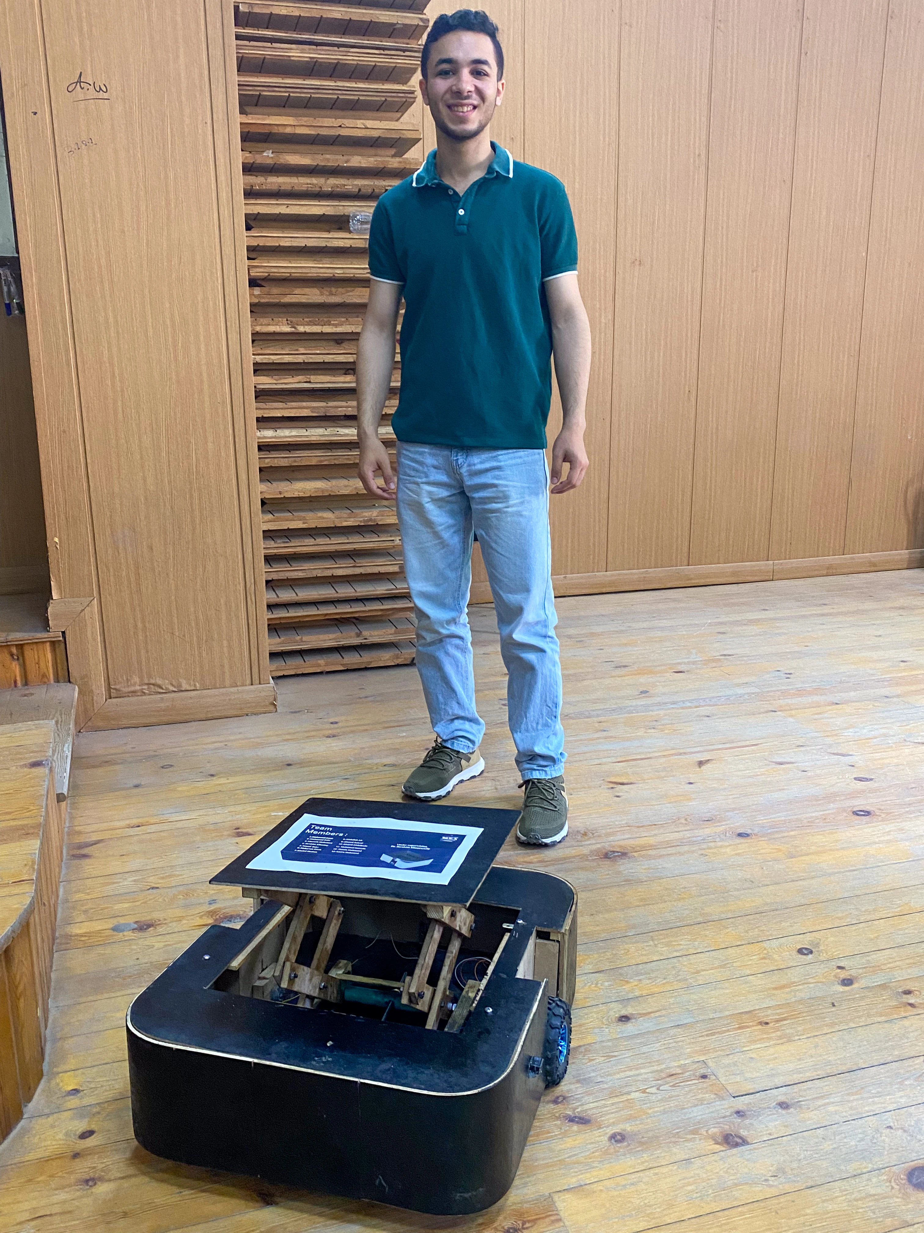 Mohamed Sakr with his self-built wheeled robot — Sakr Makes robotics and hardware engineering project